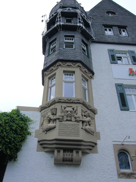 a clock tower that is decorated with carvings
