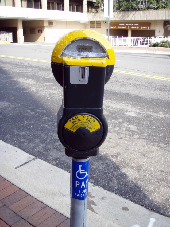 a parking meter in the middle of a street