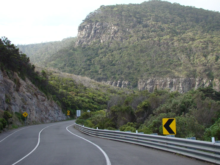 two cars on a winding mountain road