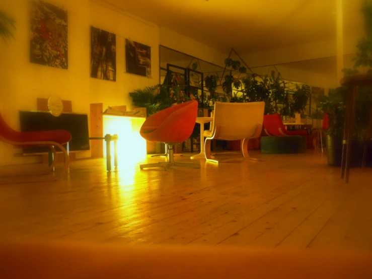 a room with wood floors and a colorful chair