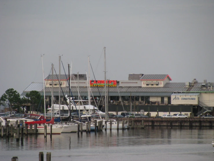 a marina with boats and buildings is shown