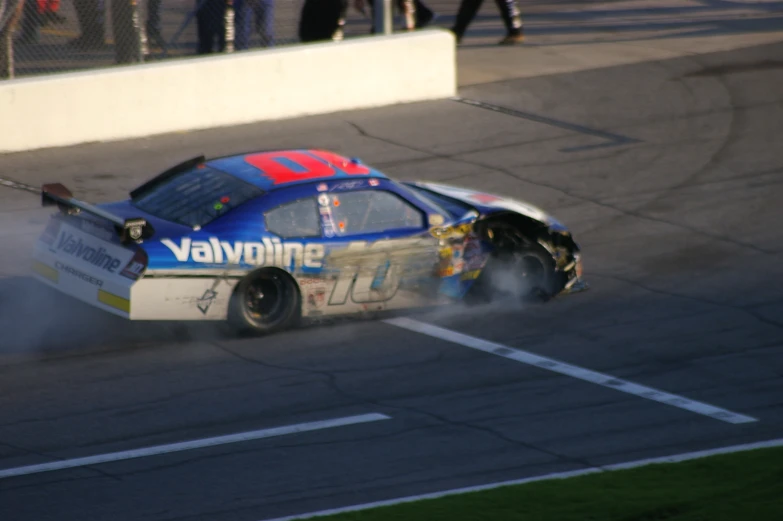 a car that is rolling down the track on its side