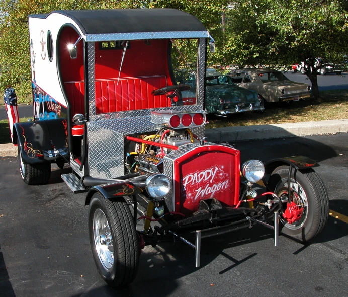 the old style vehicle is red and black