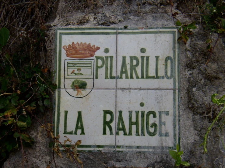 an old sign is displayed in the stone