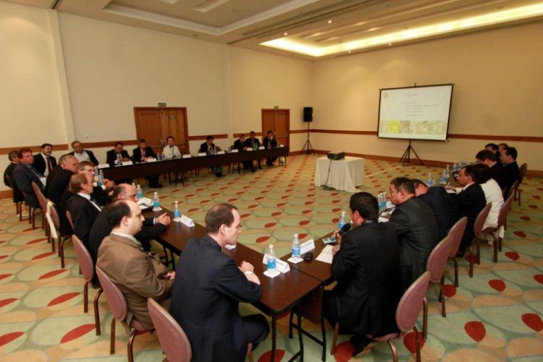 a group of people sitting at tables in a room