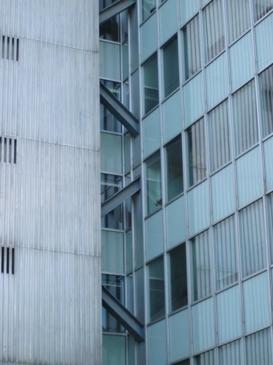 two tall buildings next to each other in front of a building