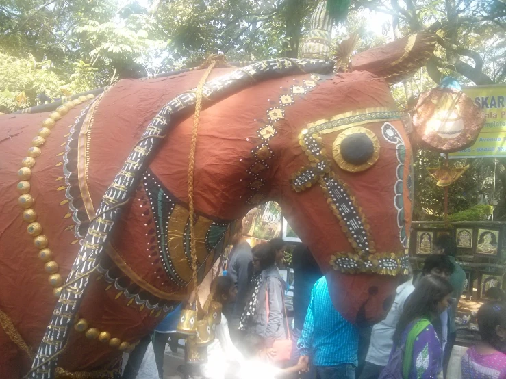 the horse is decorated with beads and beads