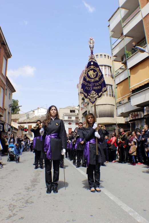 the woman is wearing a purple outfit