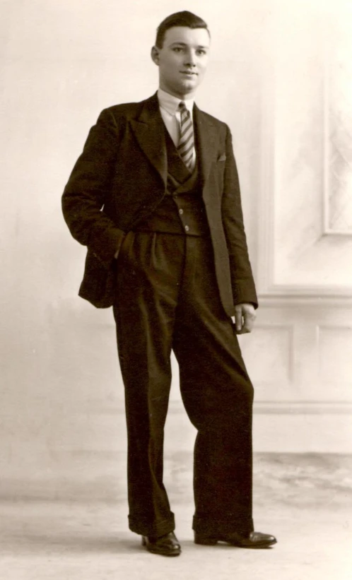 a man in a suit with a tie posing