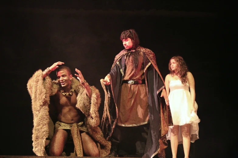 the actors perform in the play, including a man in fur