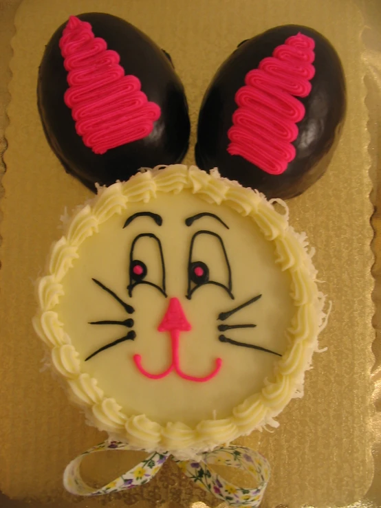 a cake decorated with a cat and dog's head