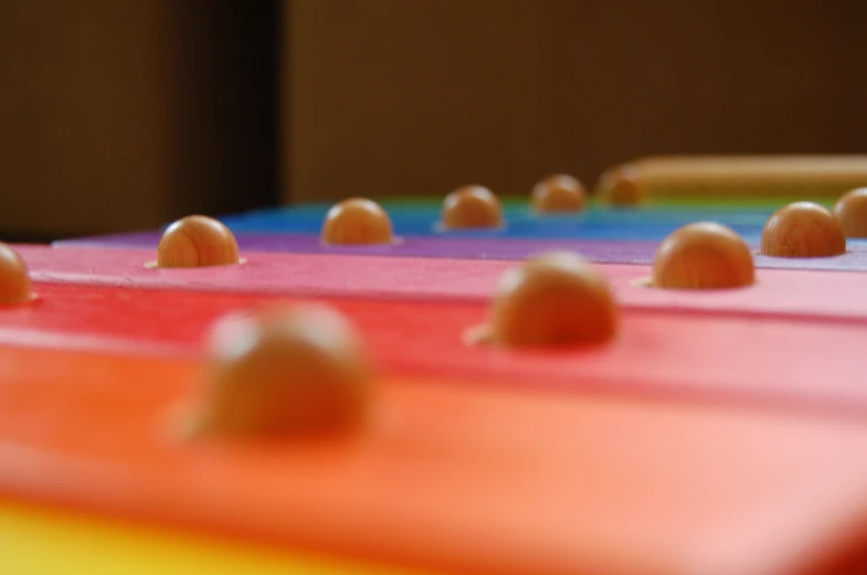 oranges and pinks are arranged on a colorful counter top