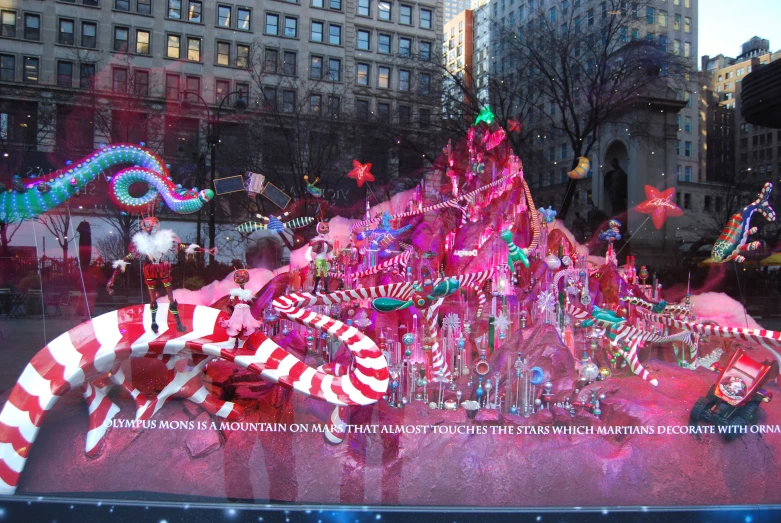 a window covered in bright colored christmas decorations