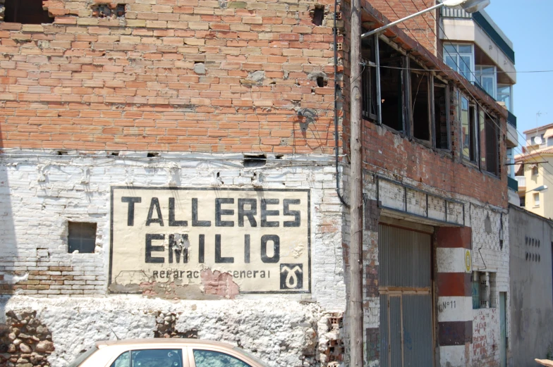 a faded out building with a white car parked in front