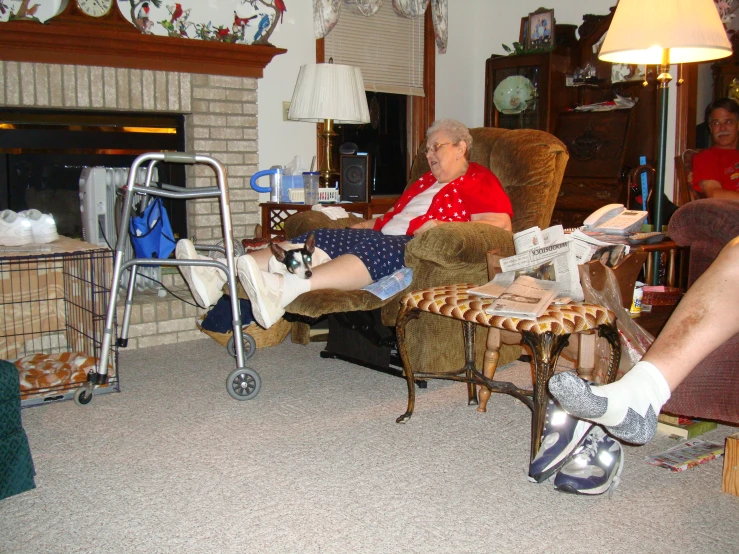 an elderly person in a chair next to a fireplace