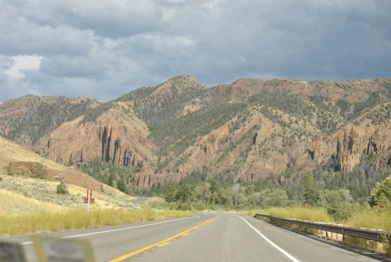 a road with some mountains in the background