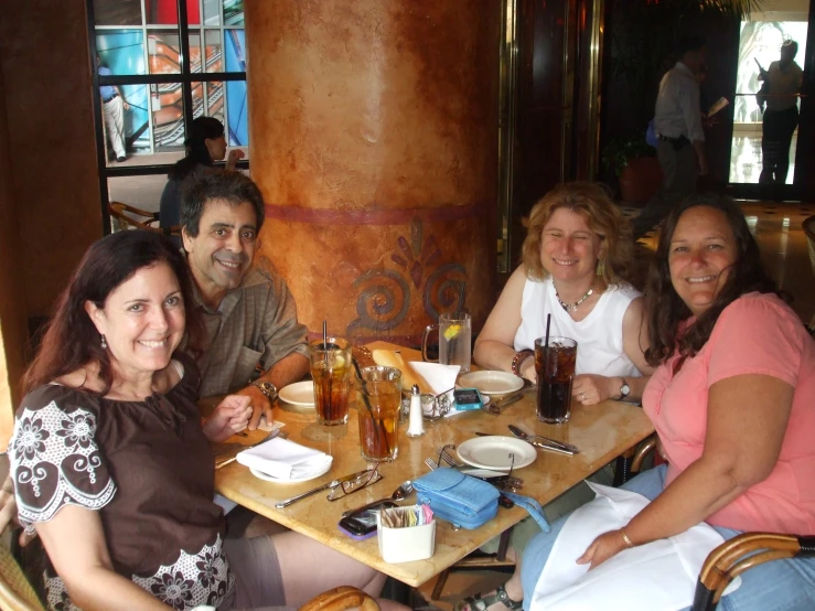 a group of people sitting around a table