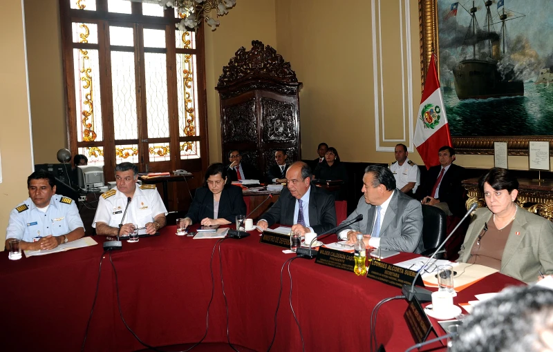 a group of people sitting at a table together