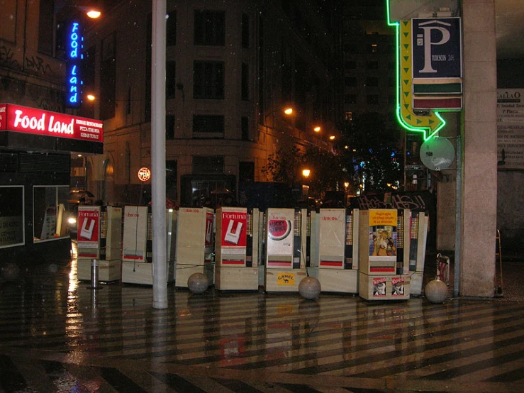 many signs and a post in the street