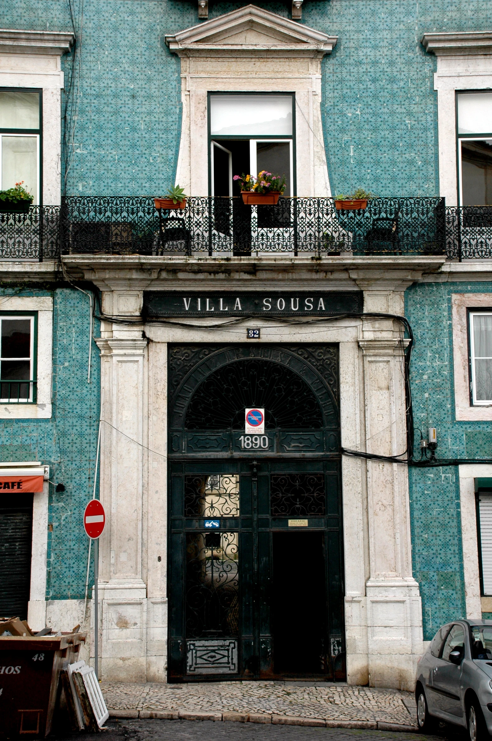 a tall building with a balconies on the top