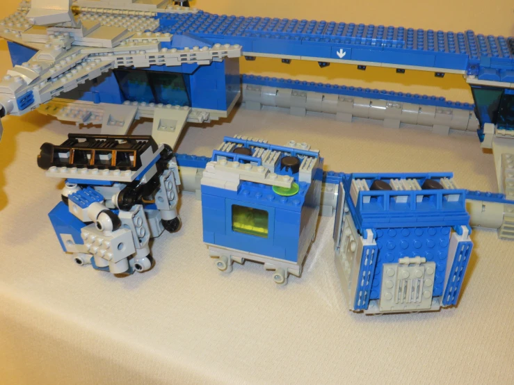 three sets of lego structures made of multiple parts