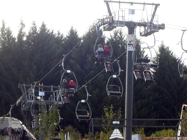 a ski lift carrying people down the mountain