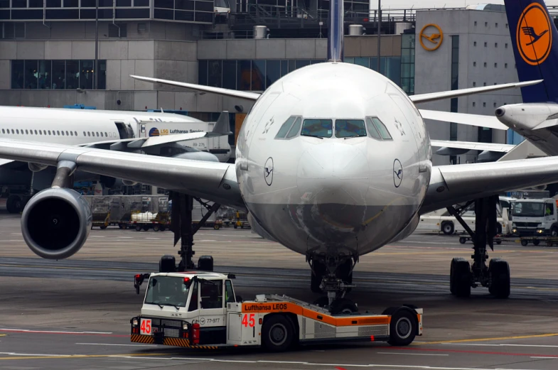 a large airplane parked on an airport runway