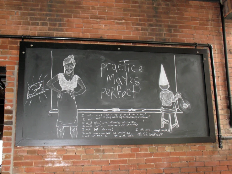 a chalk board hanging against a brick wall with an illustrated drawing