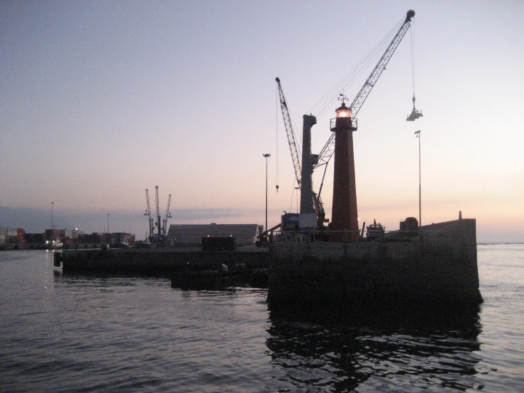 the large boat is tied up to the dock