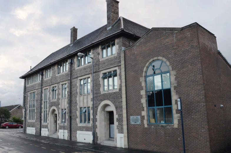 the brick building is very old and empty of people