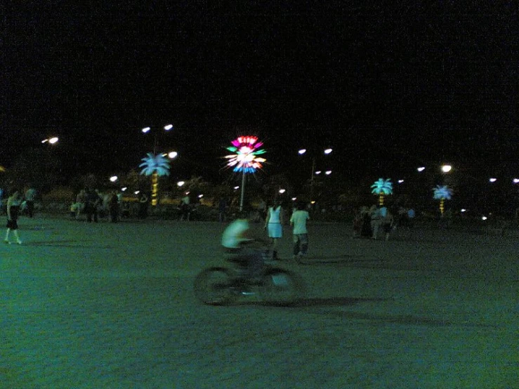 a group of people standing around with street lights