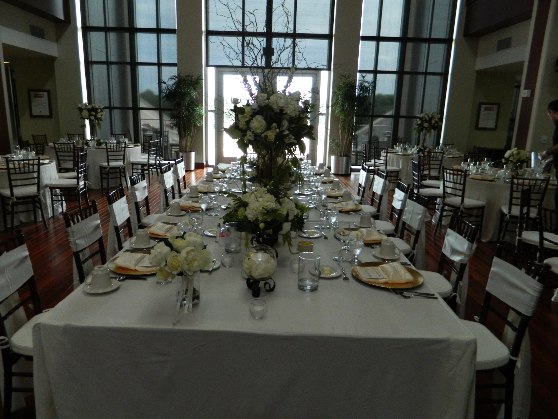 a long table with plates and place settings