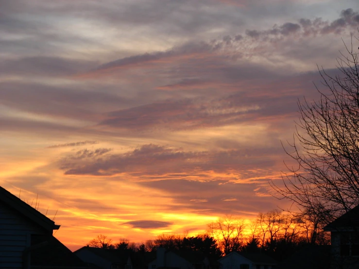 there is a orange and red sky with clouds