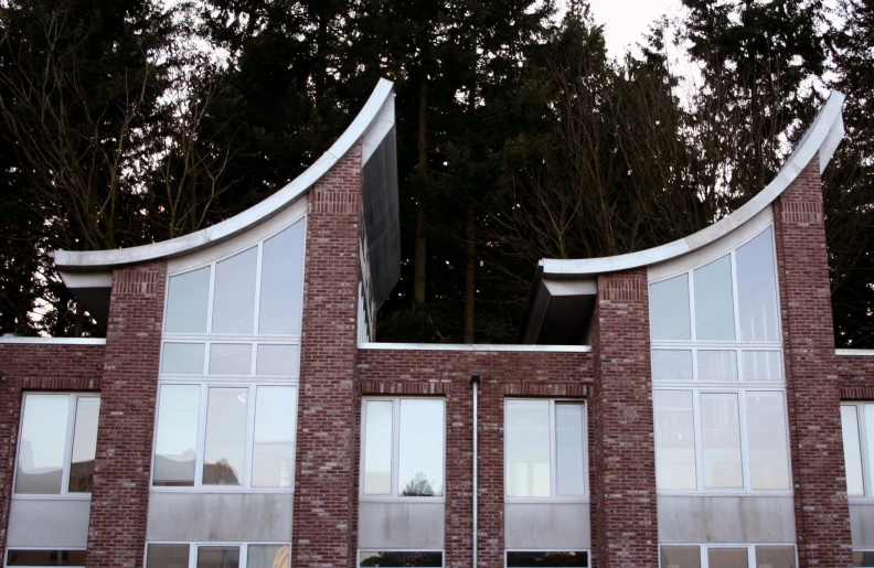 a building with several windows and a few bars above the windows