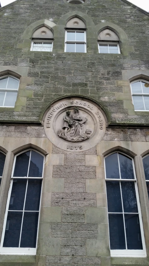 the facade of an old building with windows