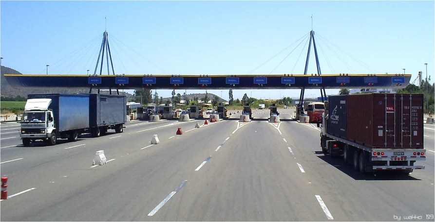 the three trucks are driving down the highway