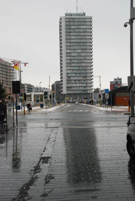 the view of the street with many buildings across it