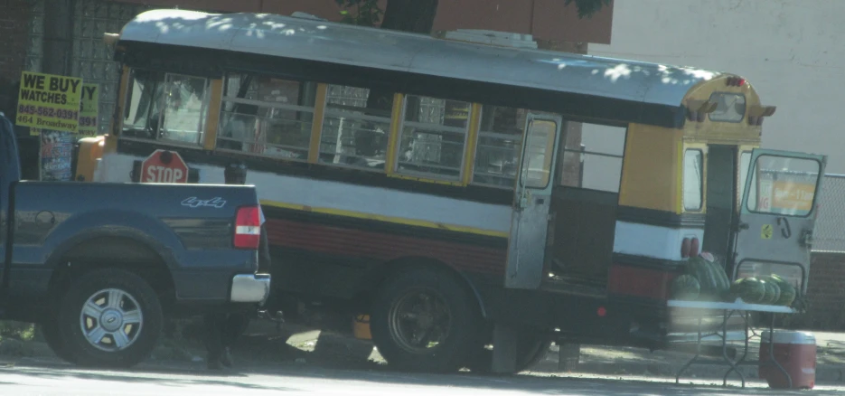 a parked bus with many windows and no doors