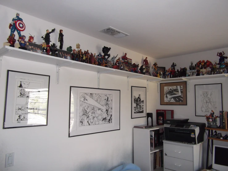 a man has a room that is decorated with avengers figurines
