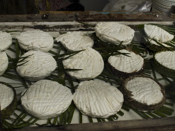 a large tray is filled with cheese pastries