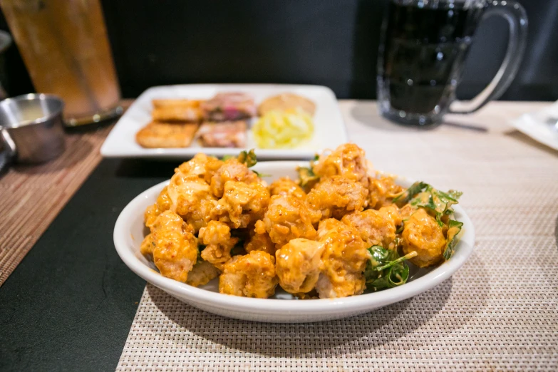 some food on a white plate on a table