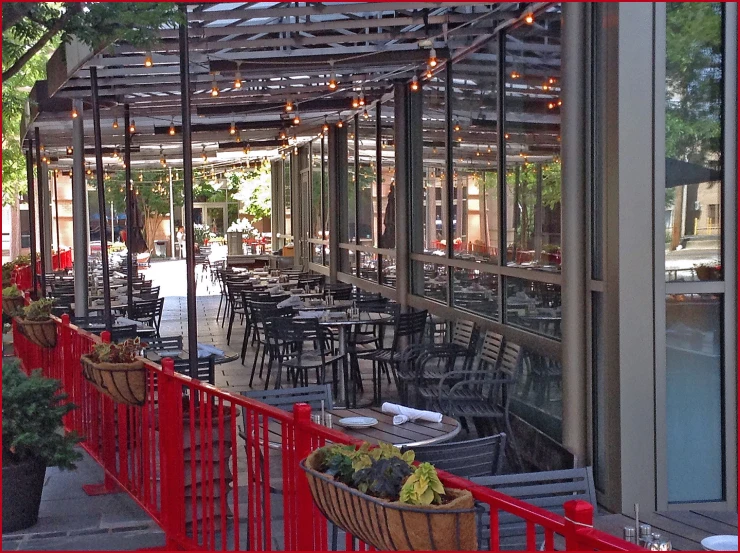 a group of tables and chairs on an outdoor patio