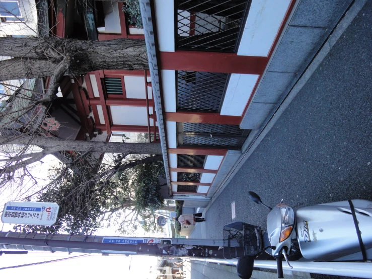 the side view of a small red and white building