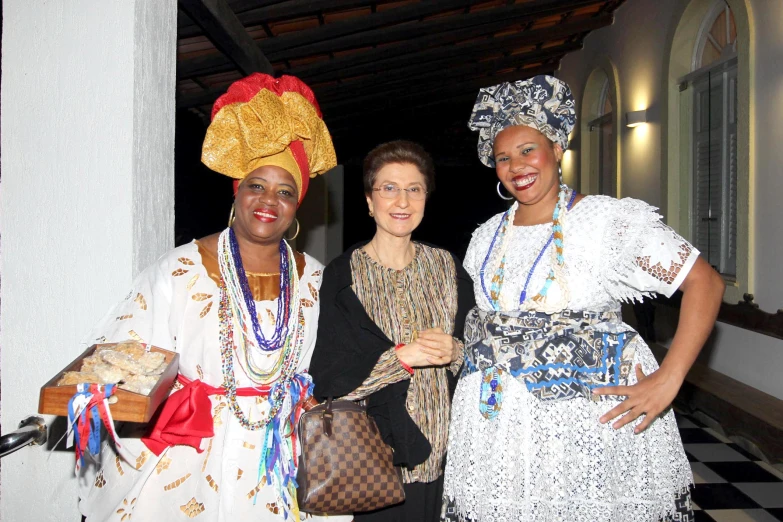 three women dressed in some african costumes