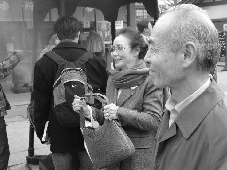 a man and woman are walking on the street