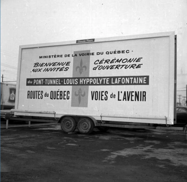 an empty delivery truck is parked on a cement lot