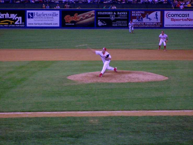 baseball game with pitcher about to throw the ball