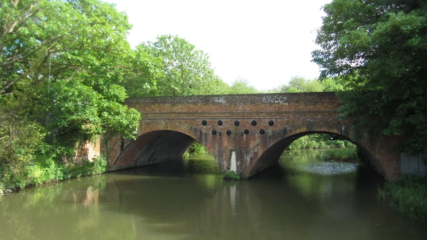 there is a stone bridge with arched arches