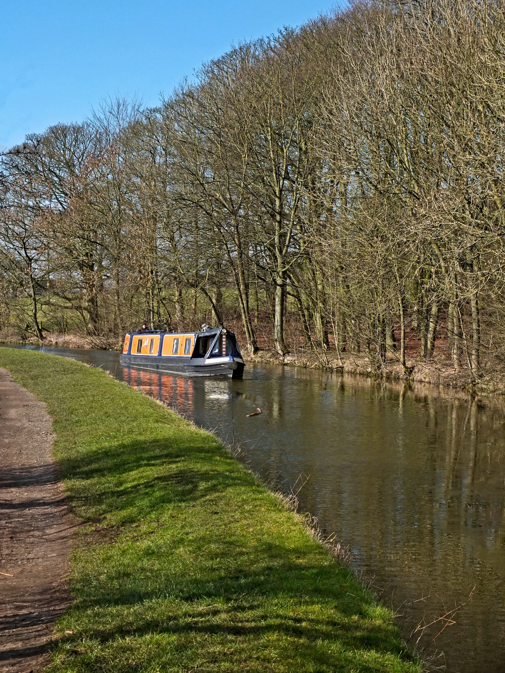 a person riding a boat down a small stream