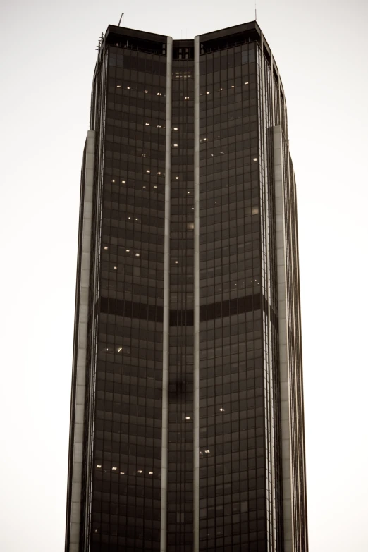 the black building is tall and has many windows